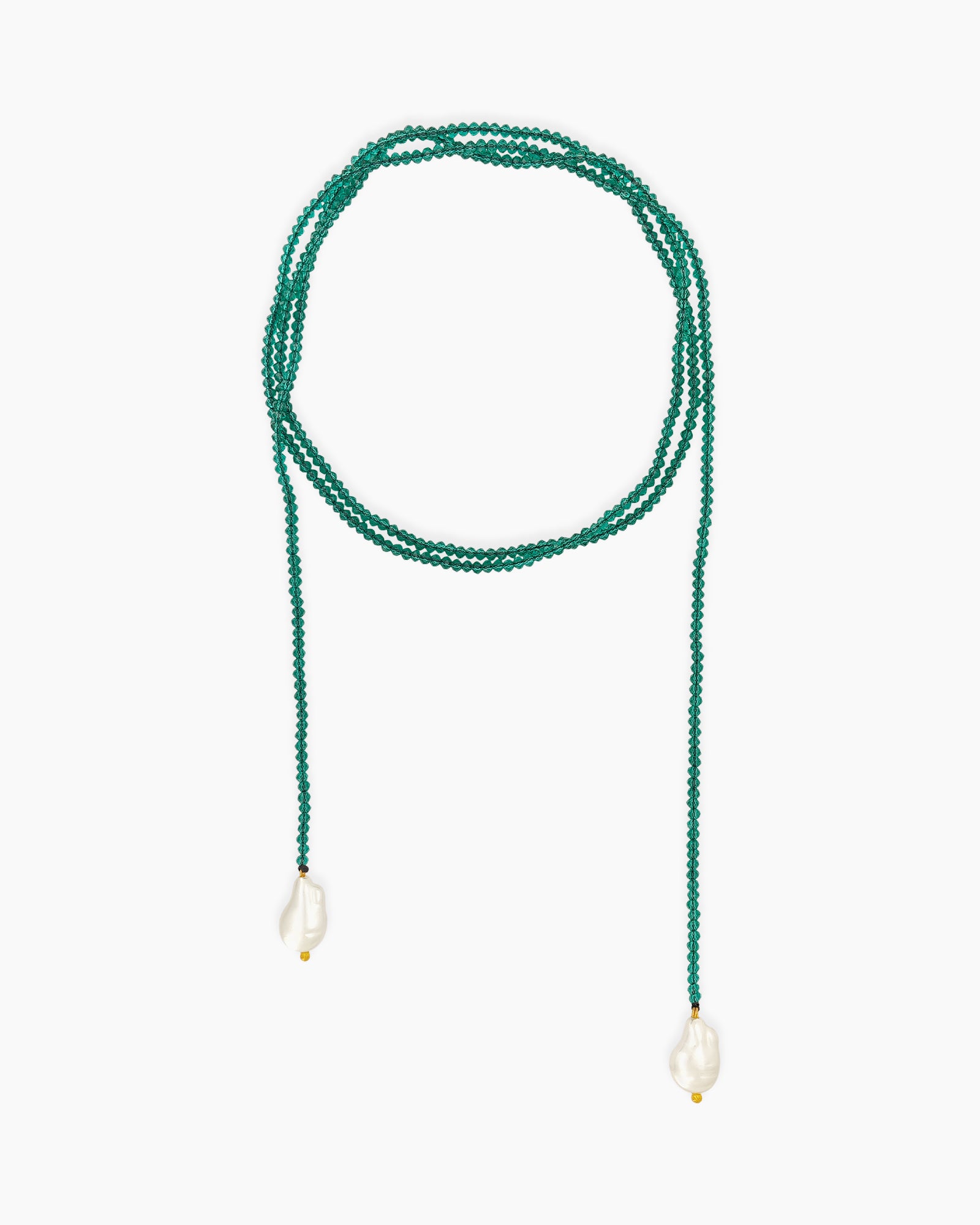 An ultra-lightweight, rope-style necklace strung with fine, deep green seed beads and luminous pearl ends