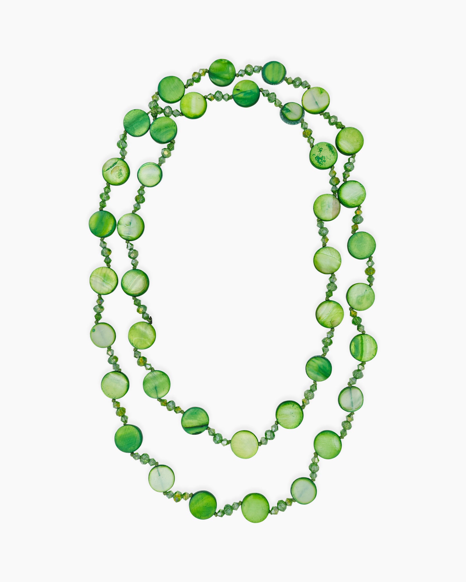 An opera-length necklace with multiple strands of glossy shell discs and faceted crystal-like beads