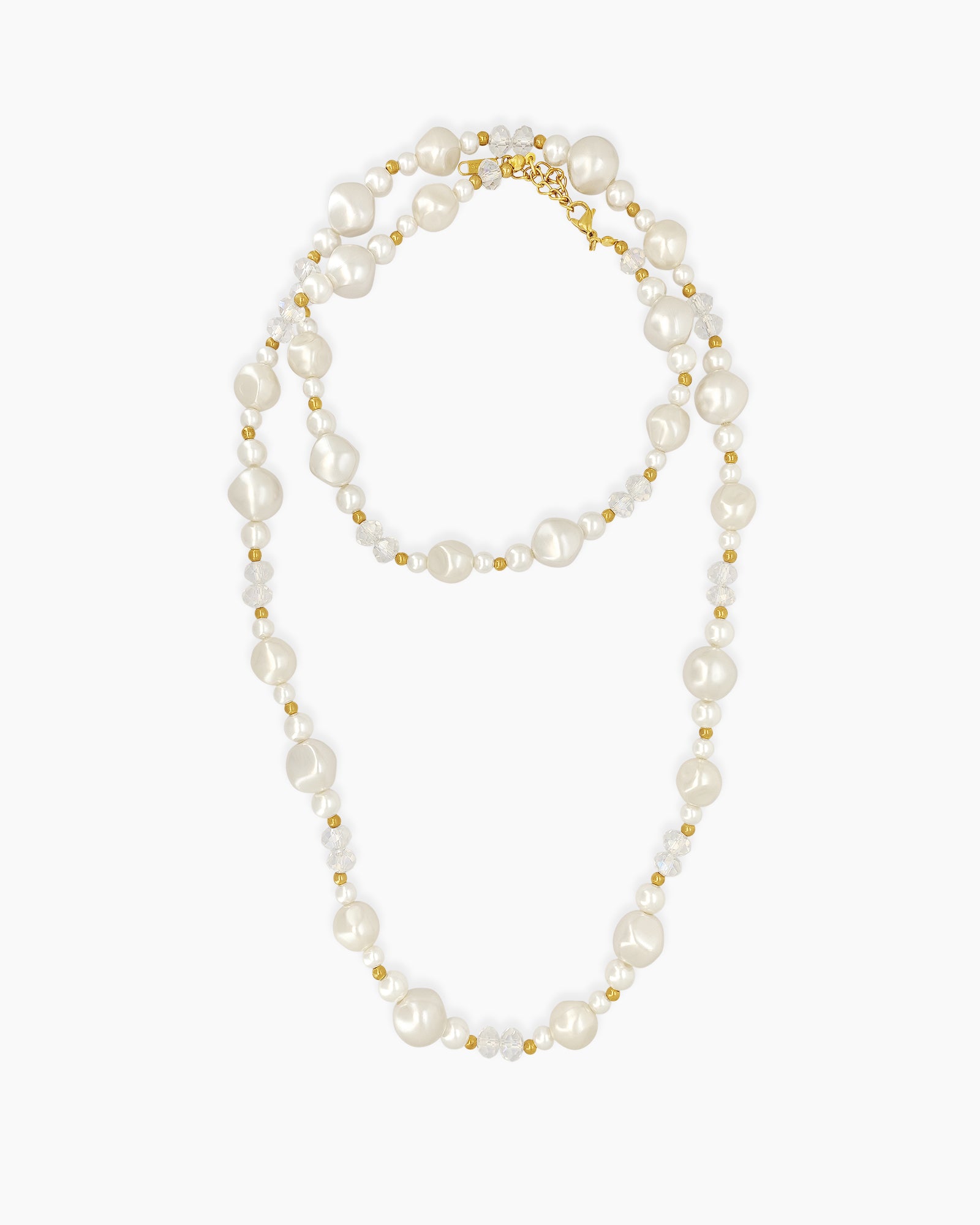 An opera-length necklace with a harmonious mix of lustrous faux pearls, faceted crystal beads, and gold spacers