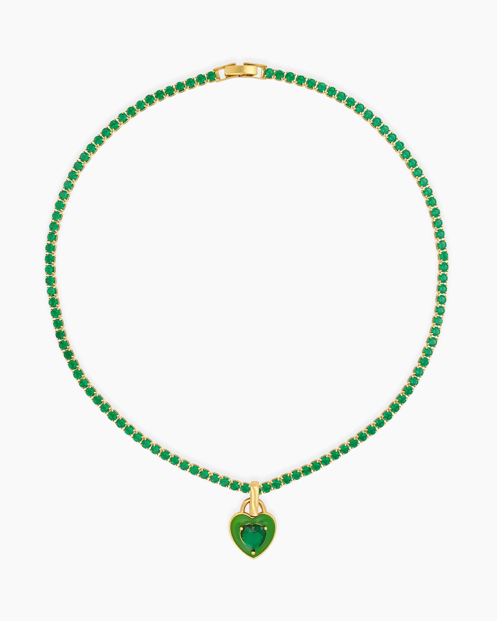 A green tennis necklace with a full strand of zircon stones and an enamel heart charm with a center stone