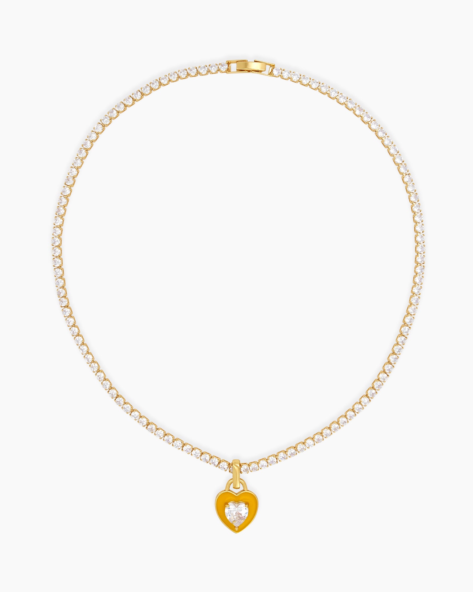 A yellow tennis necklace with a full strand of zircon stones and an enamel heart charm with a center stone