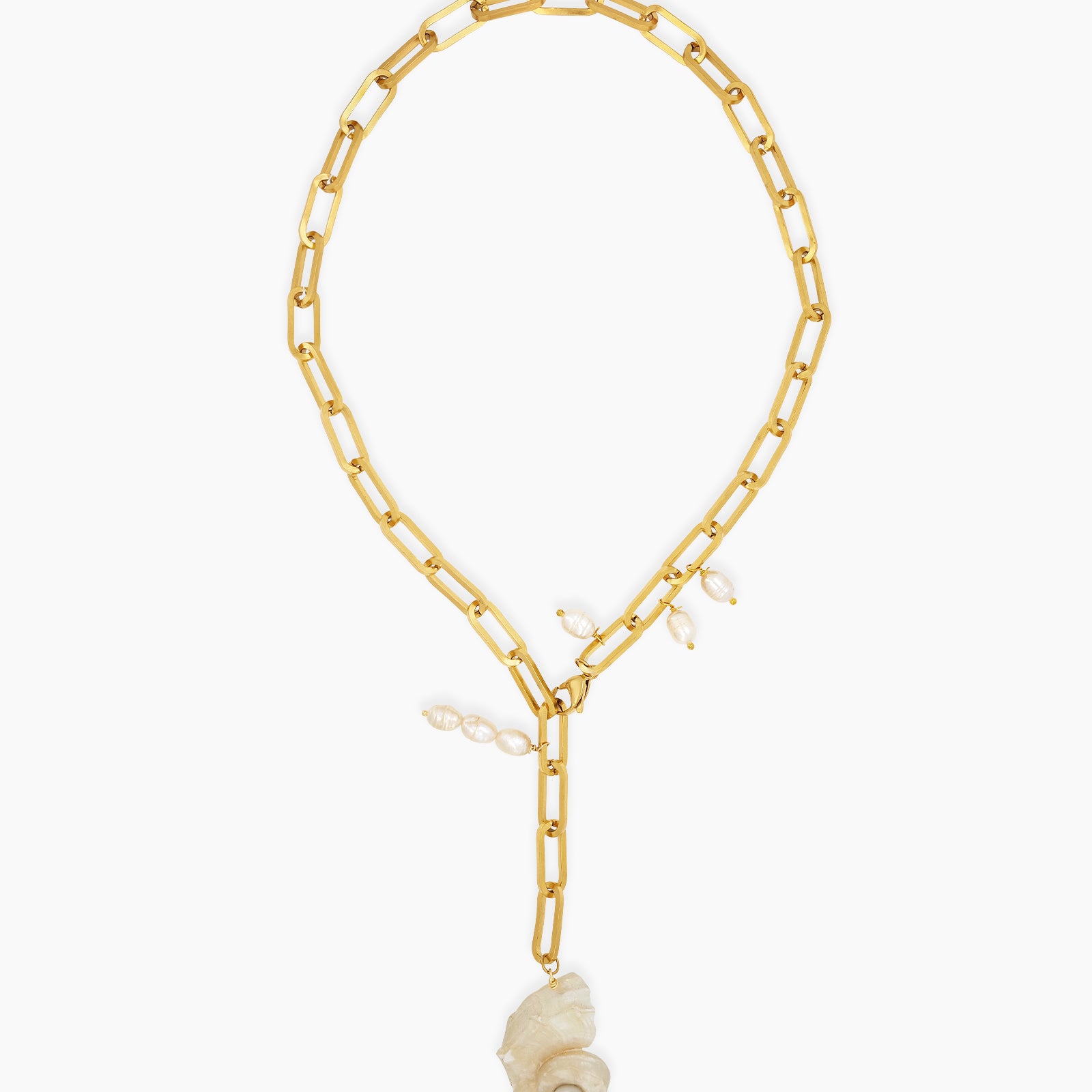 A chunky gold-tone paperclip chain necklace with delicate pearl droplets and a statement conch shell pendant