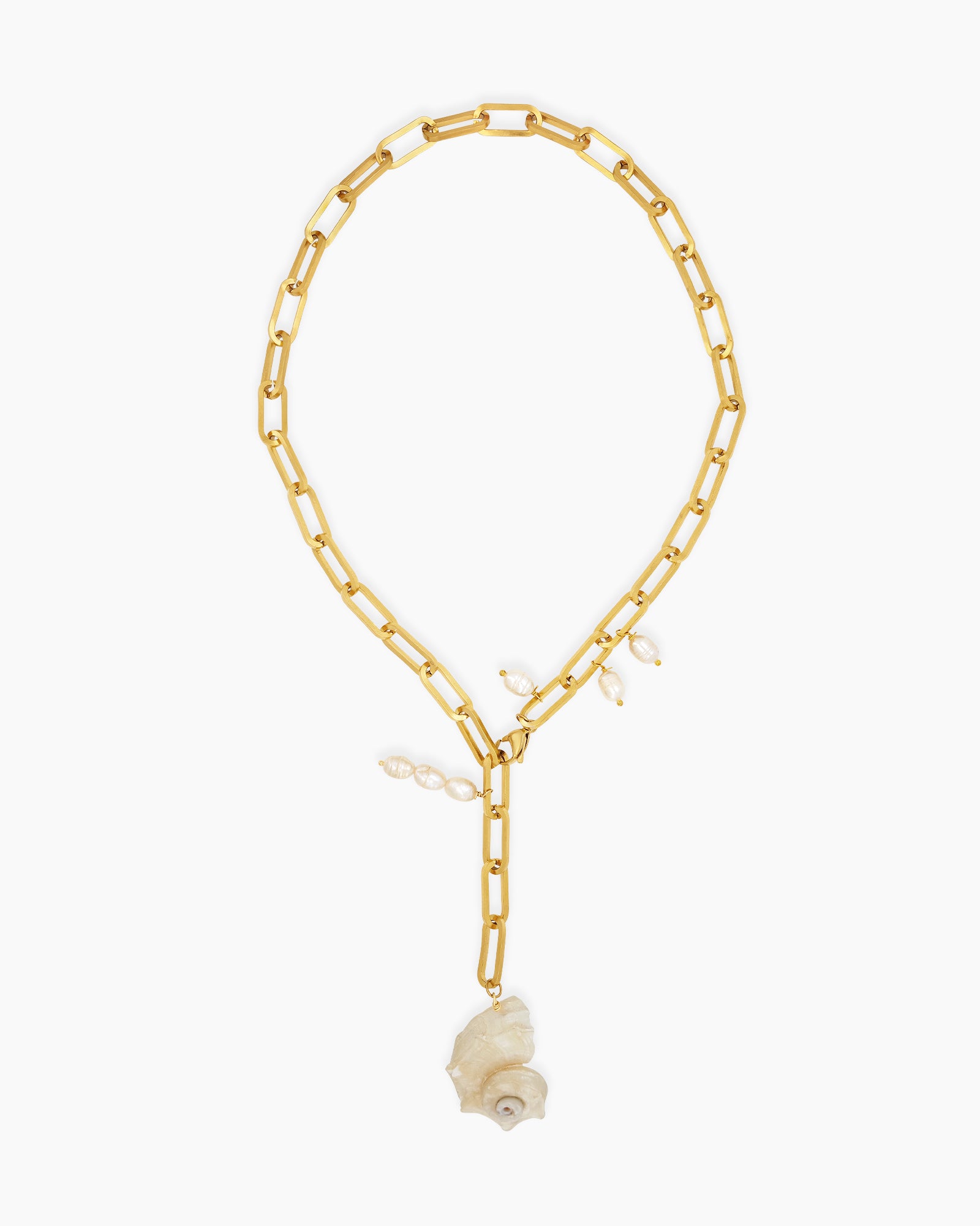 A chunky gold-tone paperclip chain necklace with delicate pearl droplets and a statement conch shell pendant