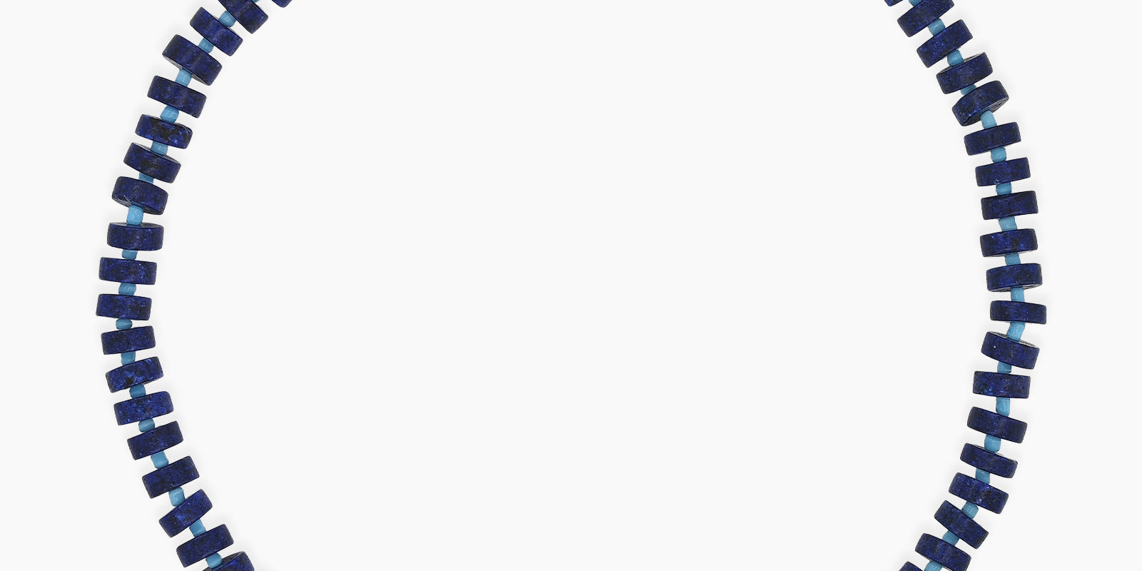 A sleek, structured necklace of navy-blue lapis lazuli beads with a glossy freshwater pearl at its heart