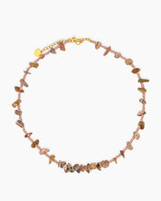A beaded necklace with a mix of warm-hued agate chips and delicate pink seed beads for an earthy feel