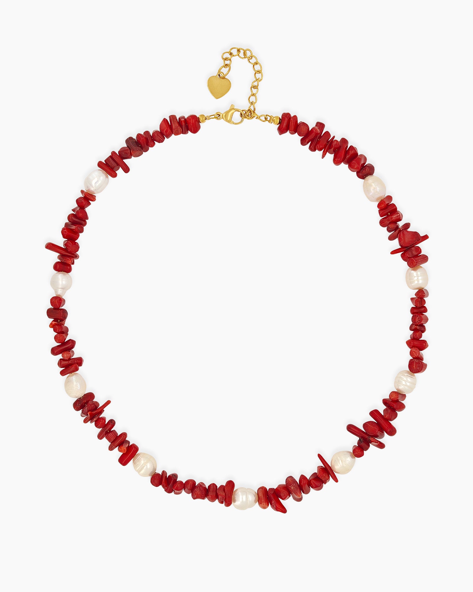 A necklace of vibrant coral stones and glowing freshwater pearls, finished with gold accents