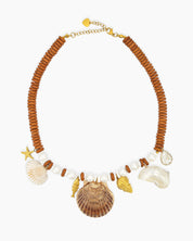 A necklace of natural wood-toned discs, freshwater pearls, and a cascade of sea-inspired charms