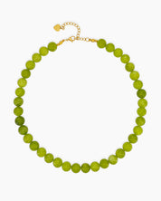 A necklace of glossy quartz beads in fresh lime and green grape tones for a zesty pop of color