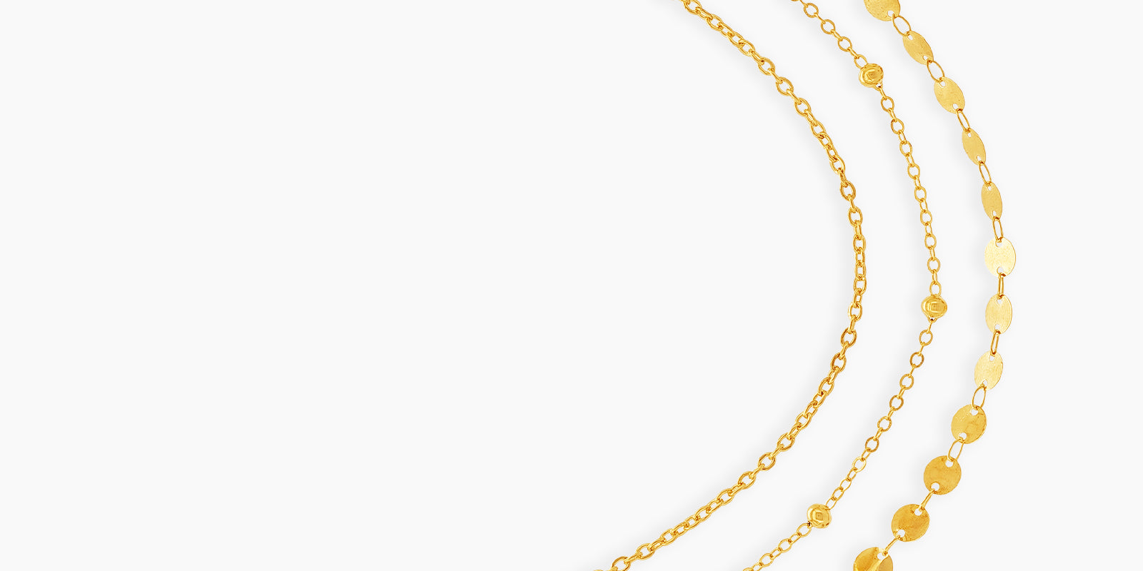 A gold waist chain with two sleek layers, one dotted with tiny beads and the other with shimmering discs