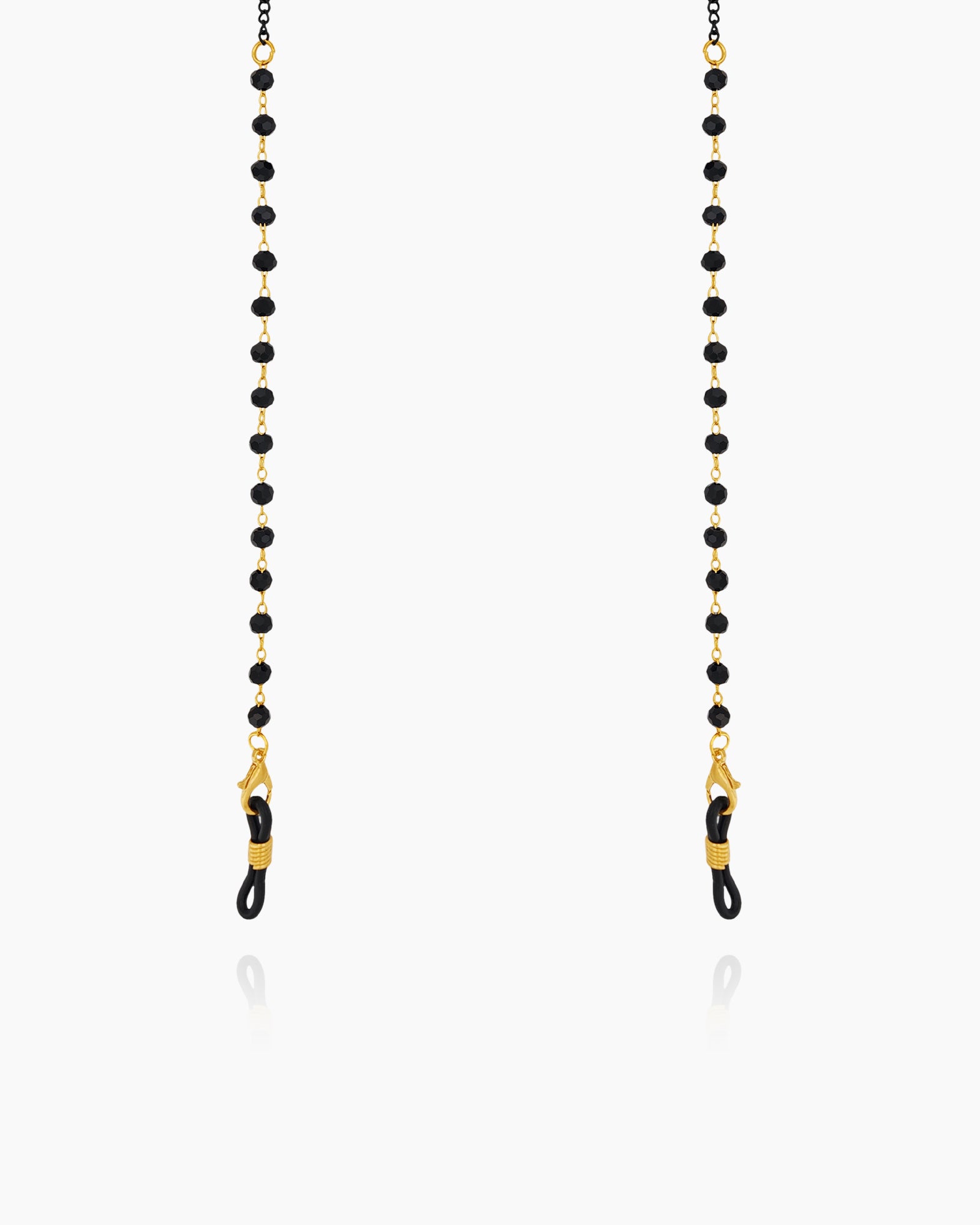 A glasses chain with sleek black faceted beads paired with fine double-link chains for a subtle edge