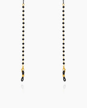 A glasses chain with sleek black faceted beads paired with fine double-link chains for a subtle edge