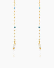 A lightweight, gold-toned glasses chain with delicate beads and subtle evil eye accents for stylish safeguarding