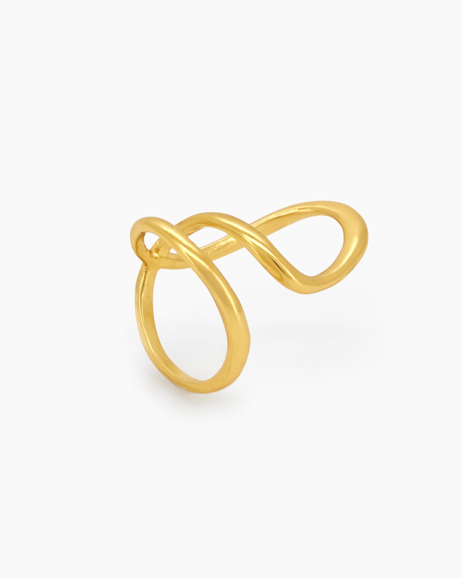 A sleek gold ring with a fluid, open curve and a high-shine finish for a modern, sculptural look