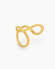 A sleek gold ring with a fluid, open curve and a high-shine finish for a modern, sculptural look