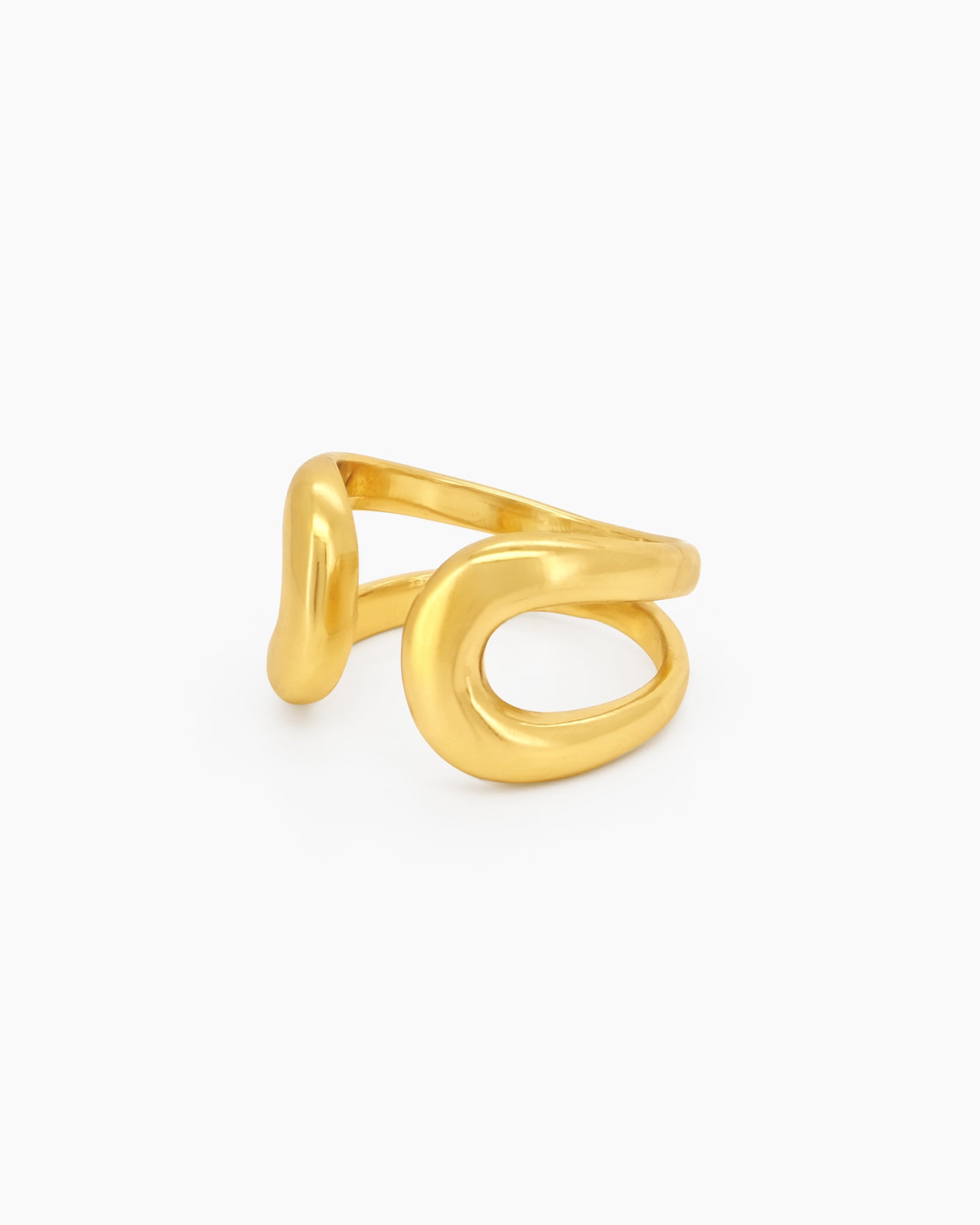 A gold open ring with a thick, smooth, and reflective curve that creates a fluid, playful presence