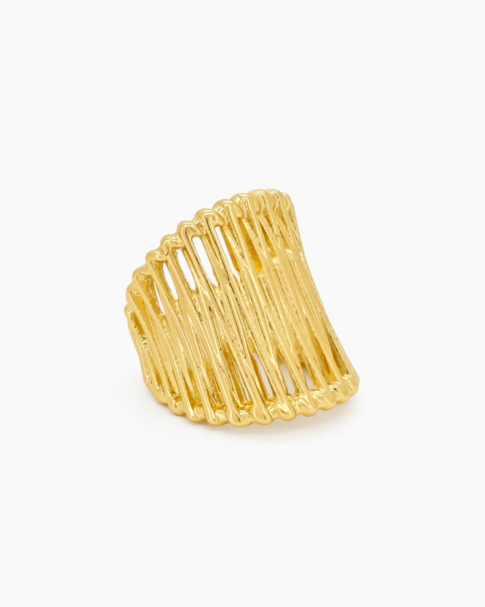 An airy gold statement ring with wavy, openwork bands and an adjustable fit