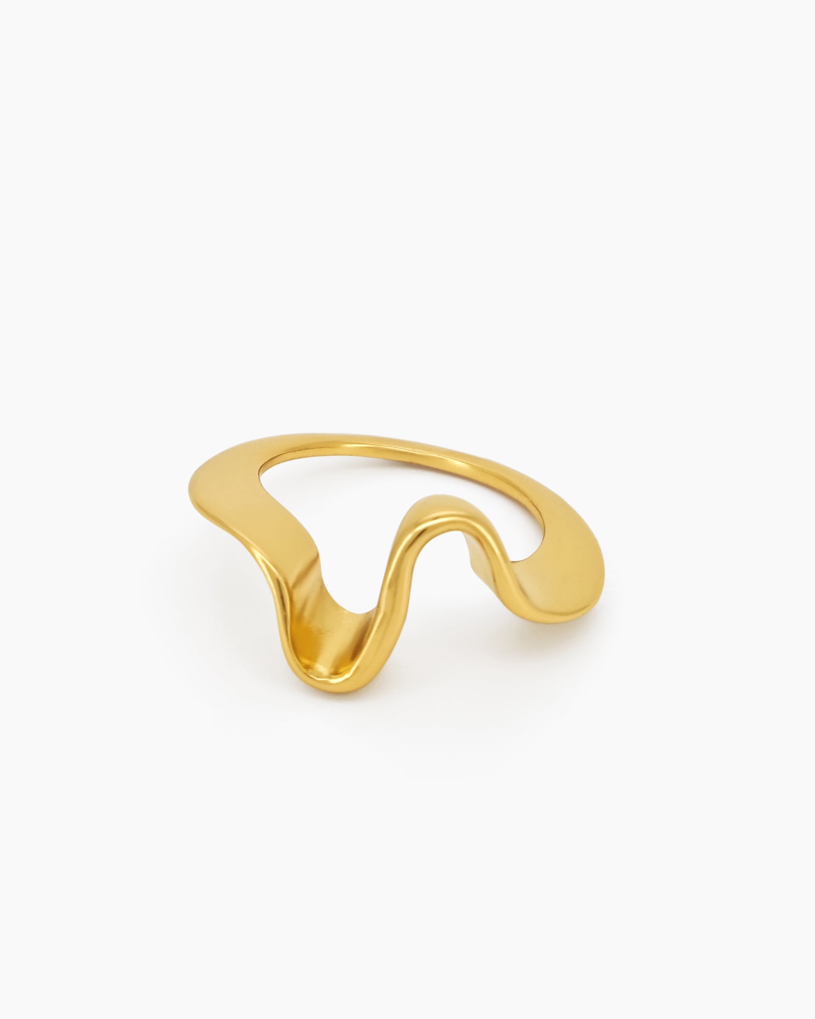 A golden ring with a curvy, freeform shape that shines with a polished, playful glow