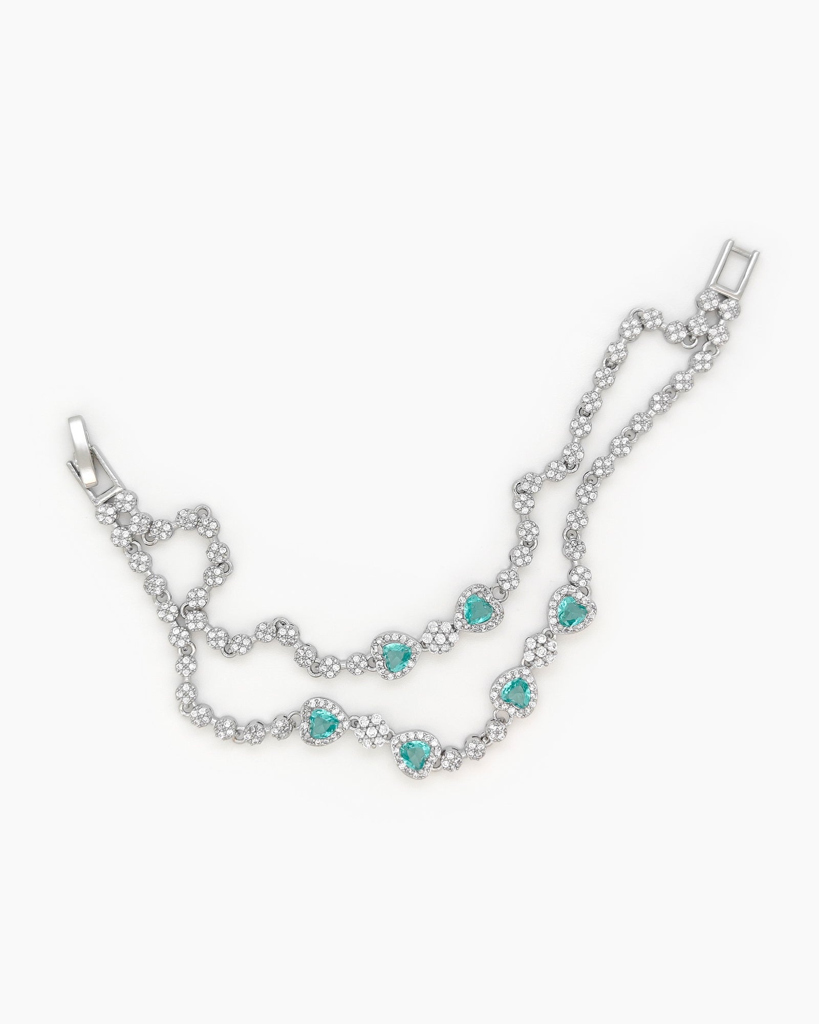 A radiant lake-blue vintage-style bracelet with two rows of zircons and five haloed heart-shaped centerpieces