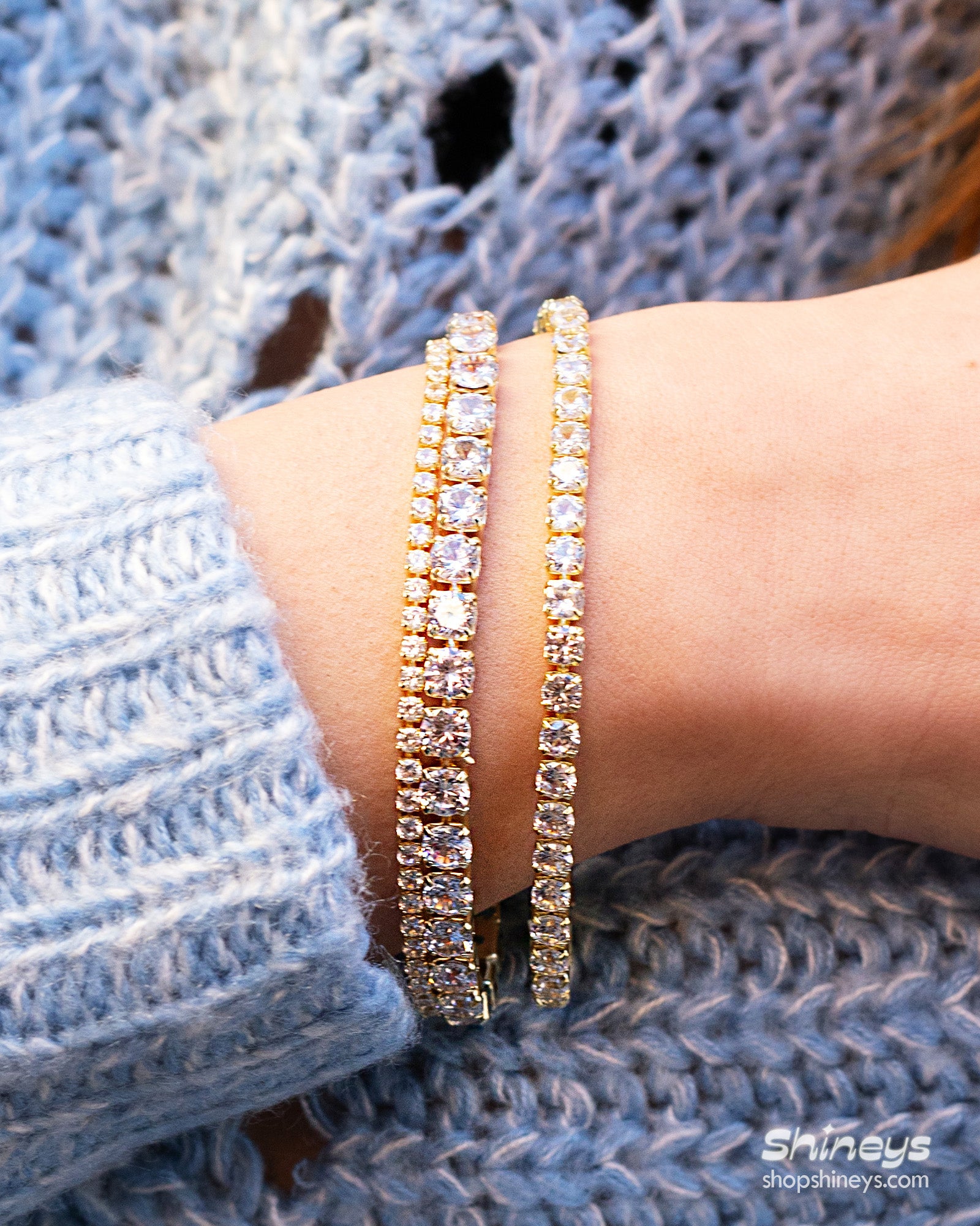 A sophisticated gold tennis bracelet with a single row of 5mm brilliant-cut zircon stones