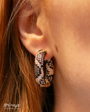 Gold-tone chunky hoops with a striking leopard-print pattern crafted from pavé-set zircons