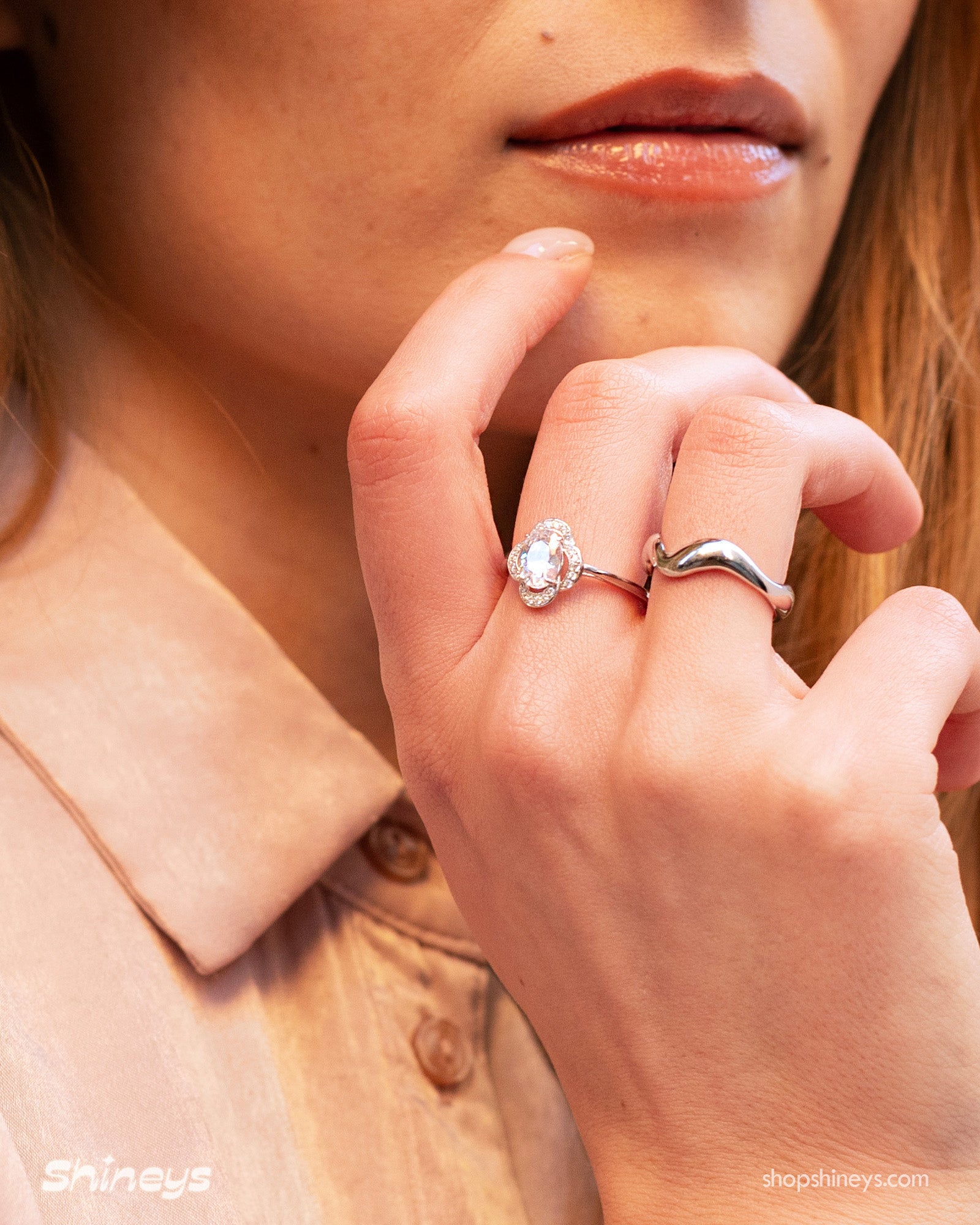 The Sana Oval Cut Halo Ring styled with the Viva Curvy Silver Ring