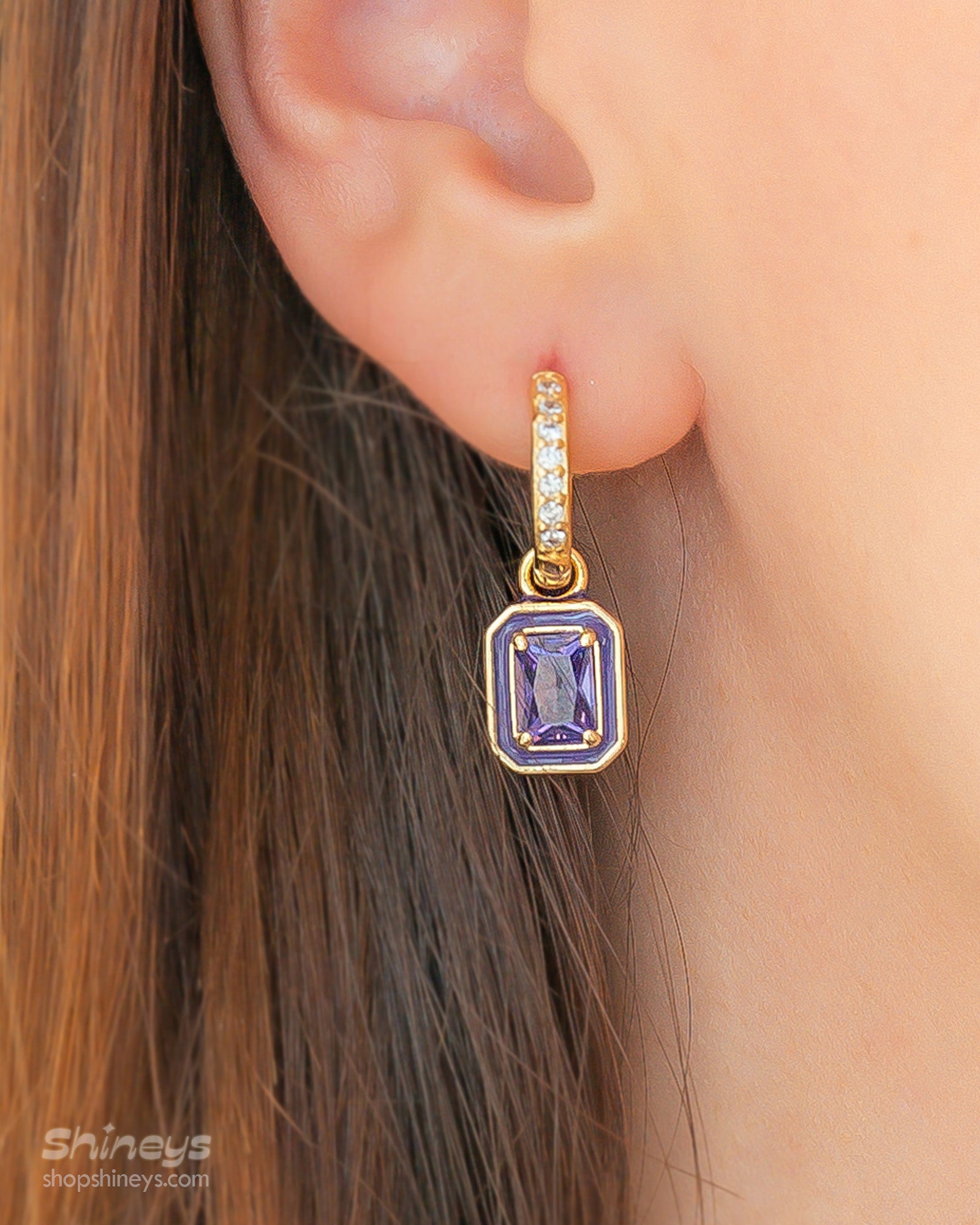 Purple drop earrings with a radiant emerald-cut zircon framed by a glossy enamel border and a pavé hoop
