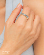 A sleek blue ring with perfectly aligned baguette-cut zircons that sparkle with quiet intensity