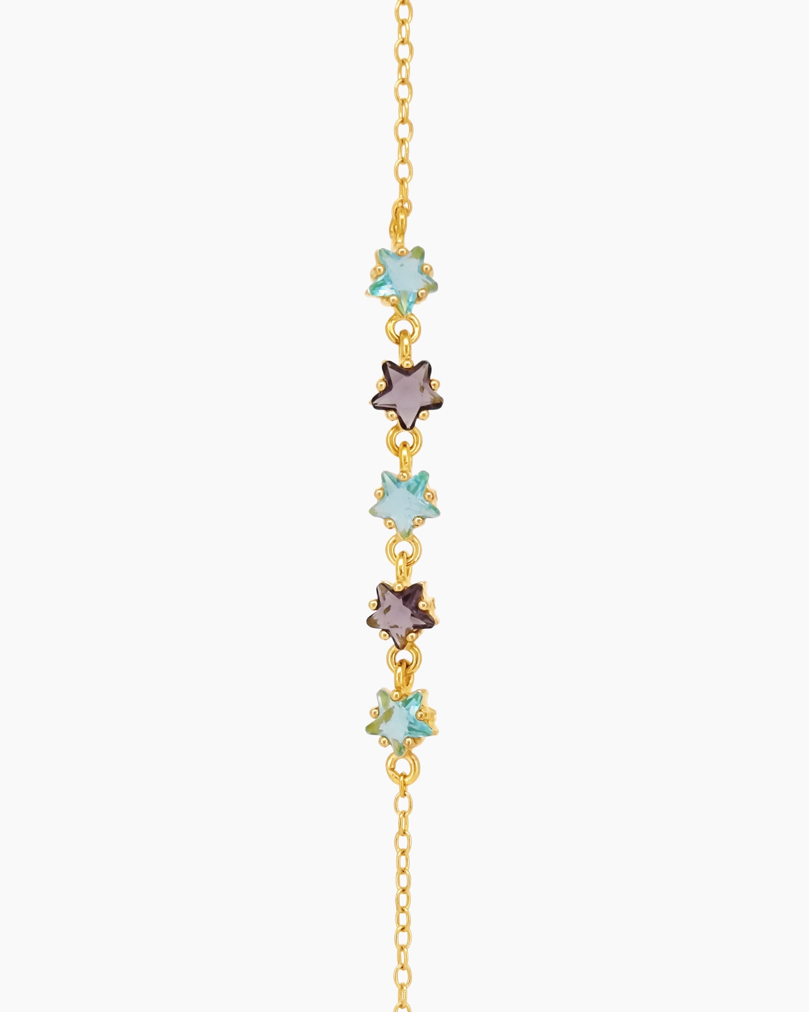 A 925 sterling silver bracelet with a gold finish, dotted with tiny star-shaped zircons in pastel hues
