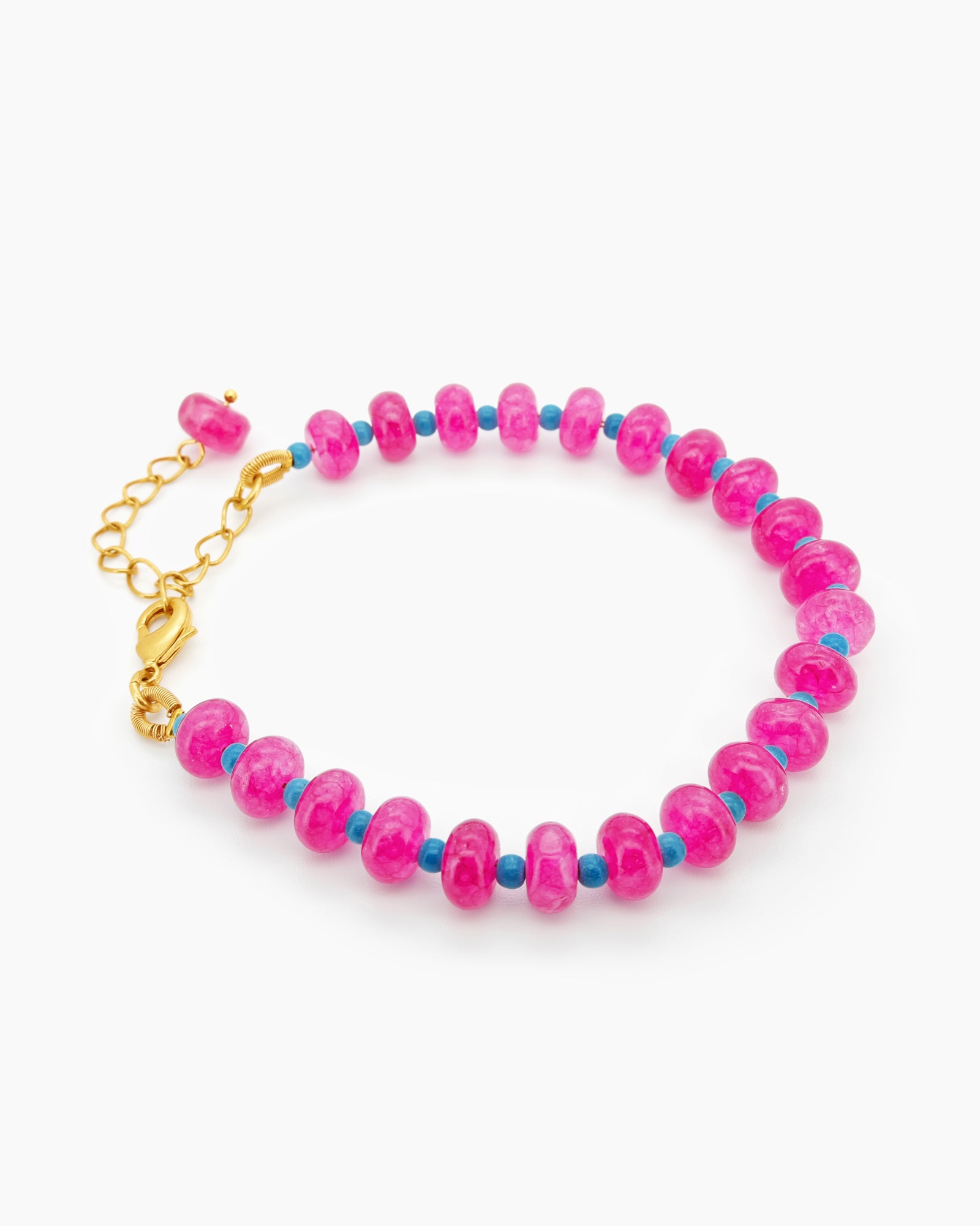 A bracelet with a striking palette of glossy pink quartz beads and turquoise spacers for a bold contrast
