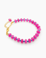 A bracelet with a striking palette of glossy pink quartz beads and turquoise spacers for a bold contrast