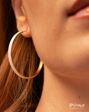White enamel-coated hoop earrings with a sleek, gold-tone structure for a classic, polished look