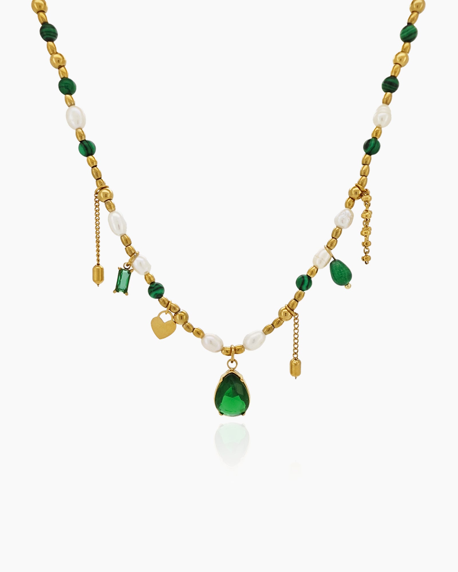 A necklace weaving together deep green zircons, freshwater pearls, and delicate jade beads