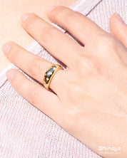 A gold-tone dome ring with a smooth finish, scattered with dainty star-shaped settings holding zircons