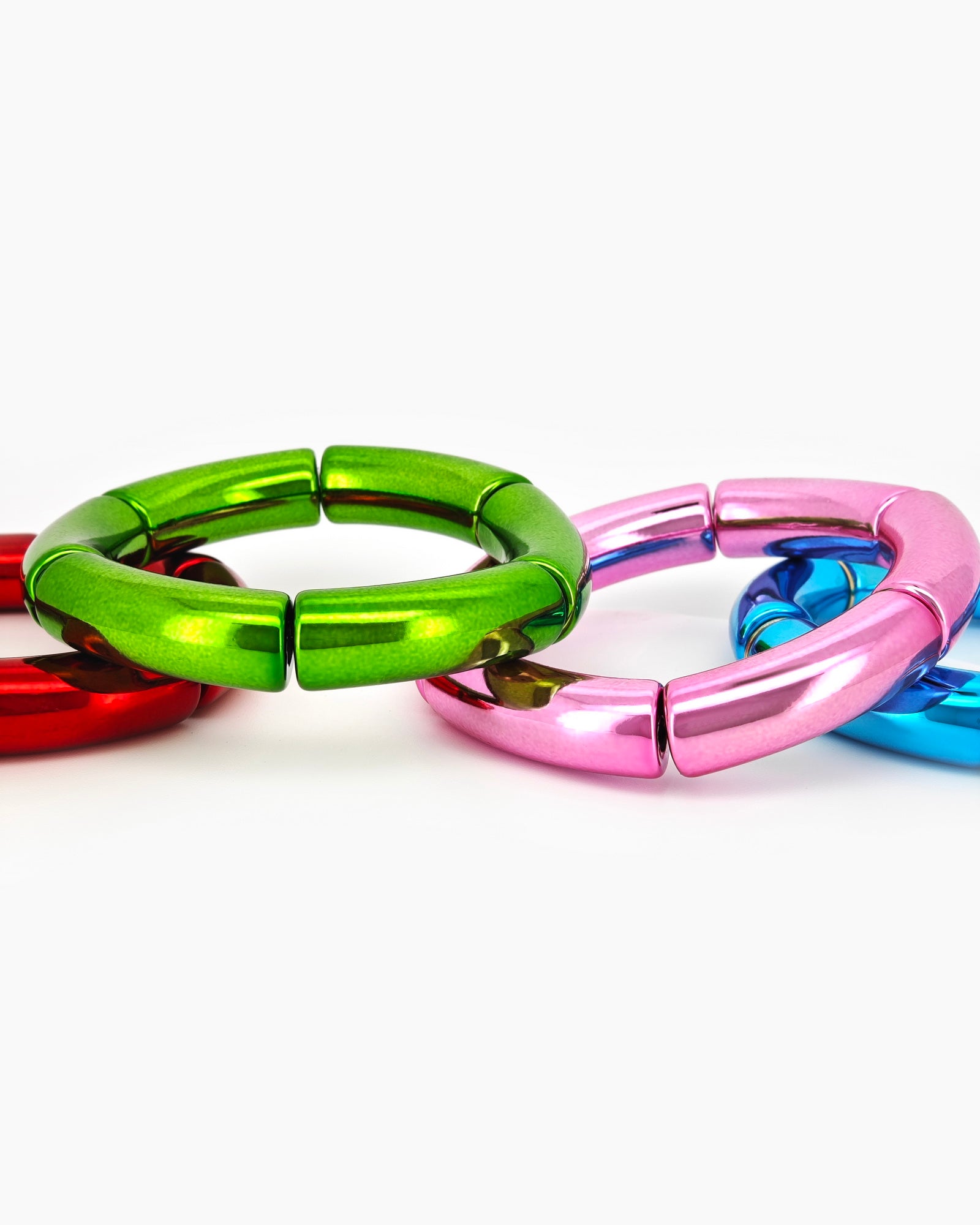 A radiant bangle with a sleek tubular silhouette and a high-shine metallic finish