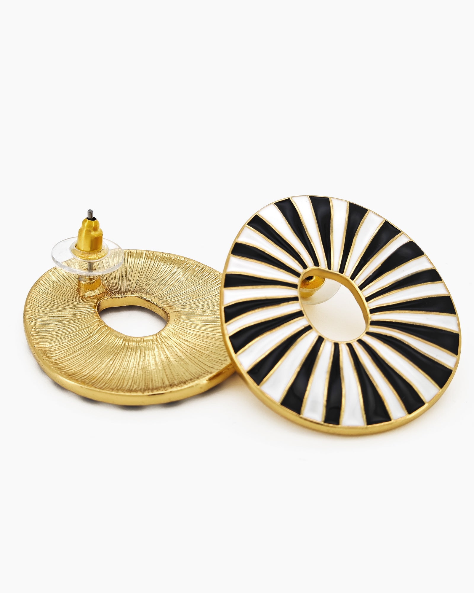 Black oval earrings with radiant enamel stripes in a sunburst pattern for a retro glamour look