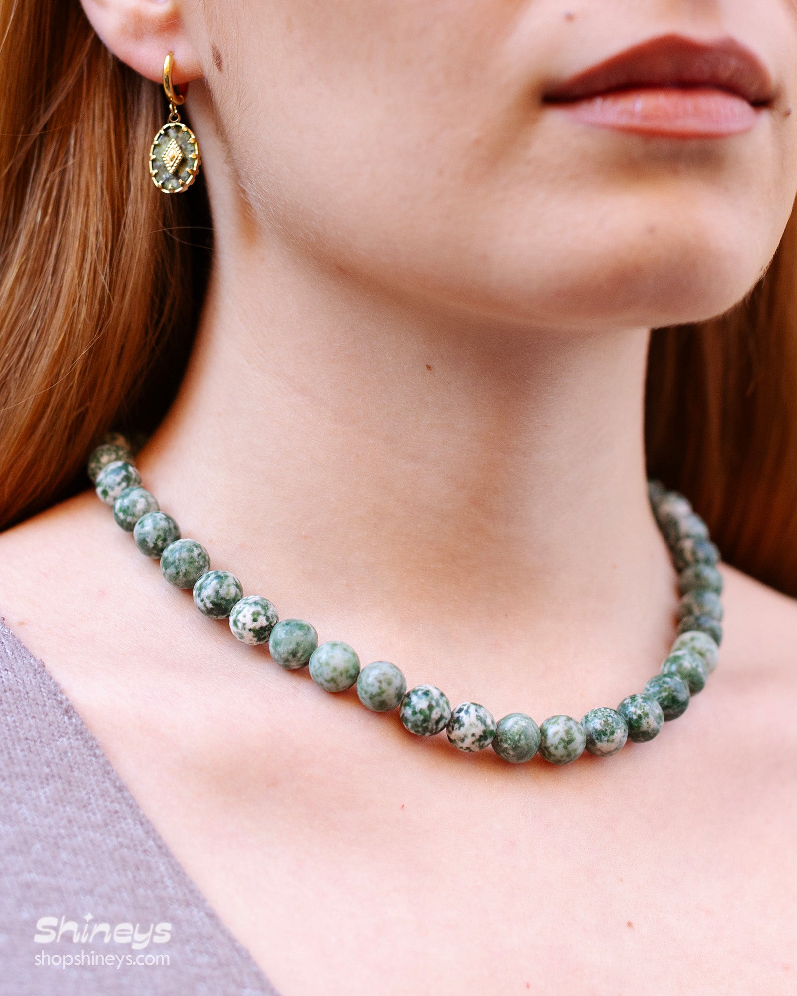 A hand-strung necklace of natural green jasper beads with soft, marbled tones for a grounded, elegant look