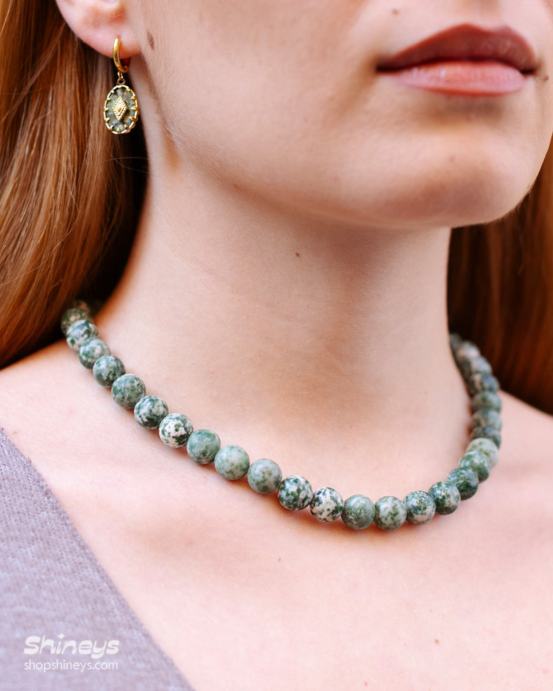 A hand-strung necklace of natural green jasper beads with soft, marbled tones for a grounded, elegant look