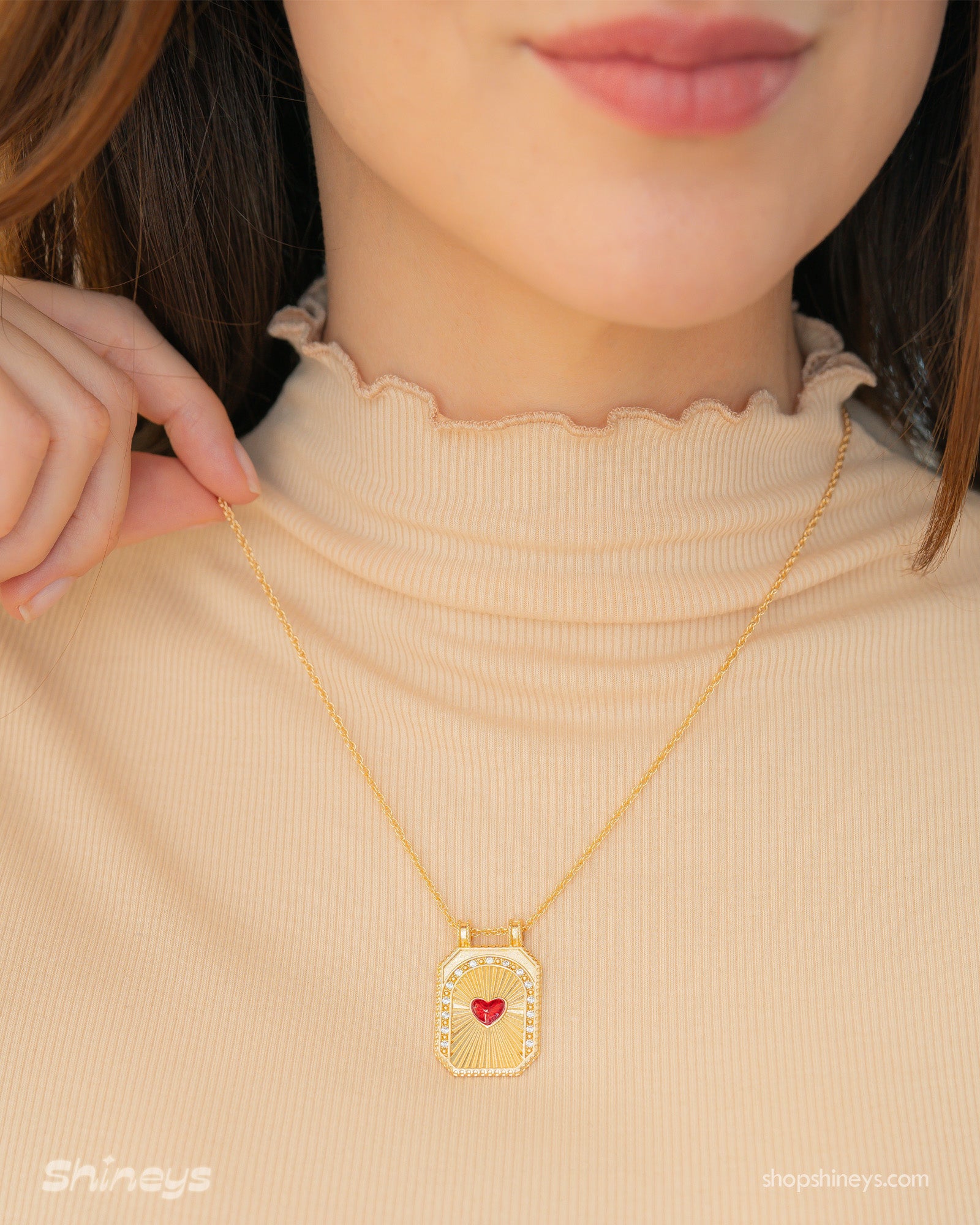 A keepsake-style necklace with a sculpted Black Mushroom pendant and sunbeam detailing on a twisted chain