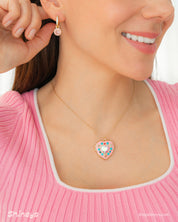 The Heidi Heart Locket Necklace paired with the Jasmine Stone Drop Earrings