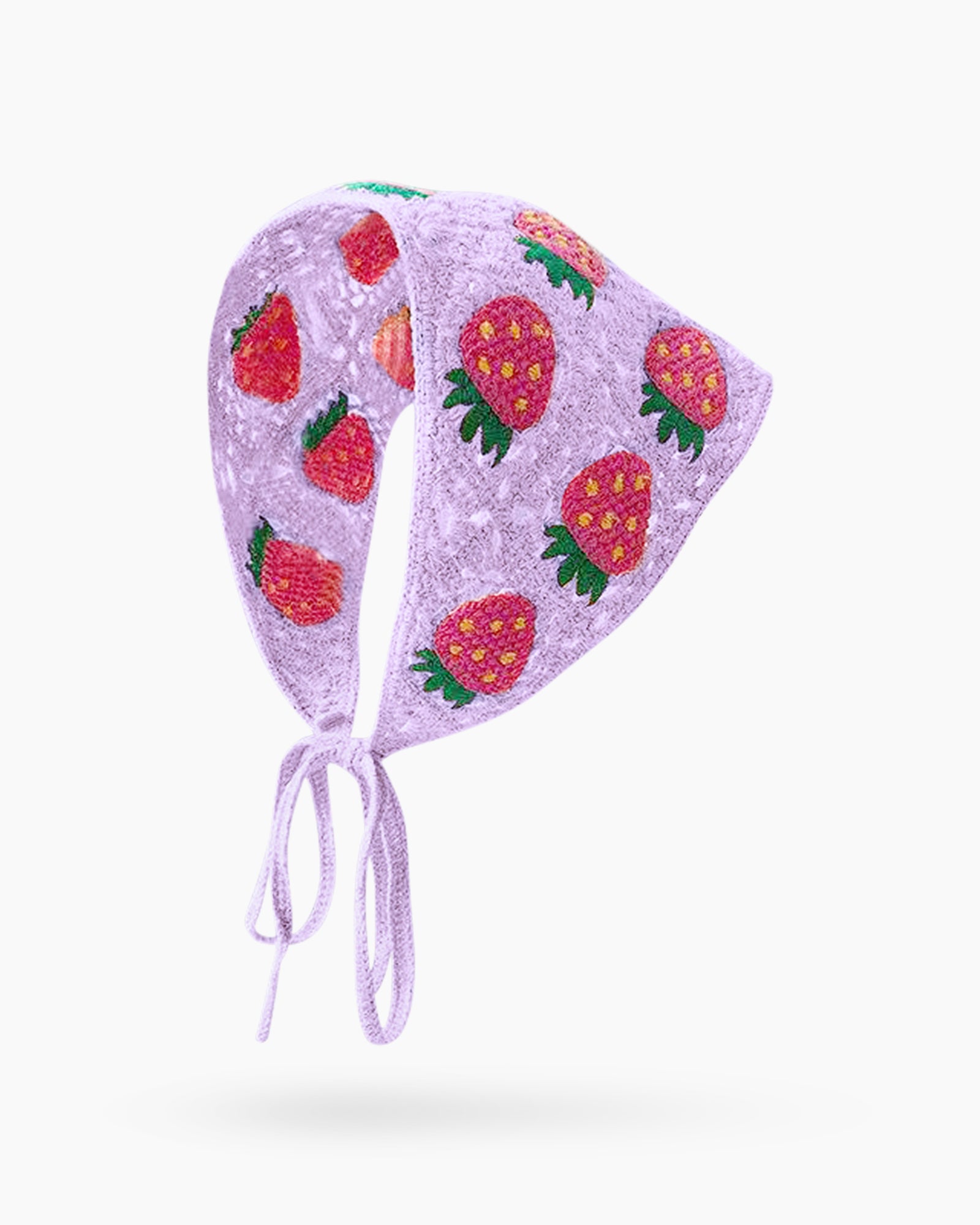 A hand-crocheted headscarf in white with adorable strawberry motifs for a sweet, whimsical look