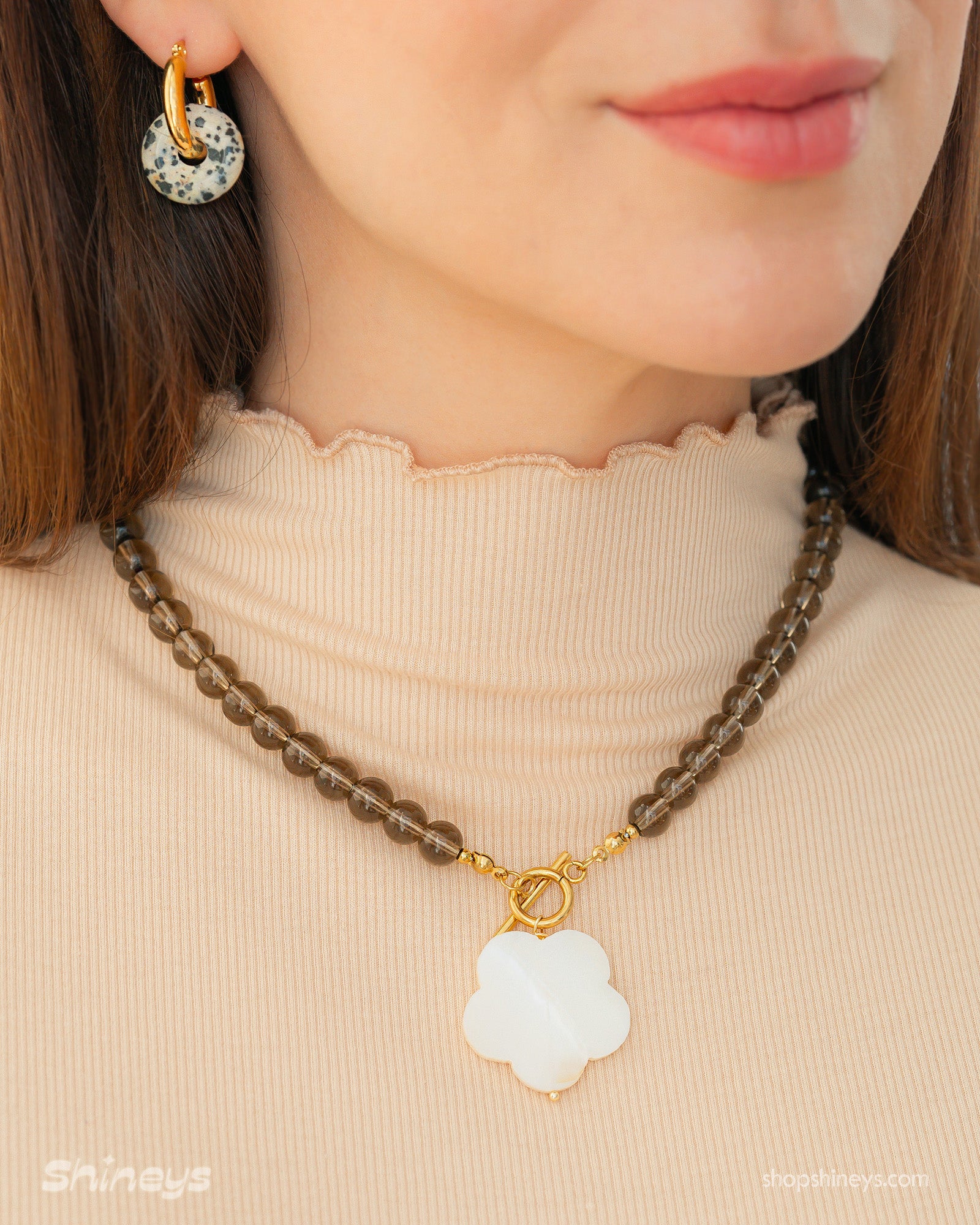 The Genoa Stone Flower Necklace paired with the Ronda Spotted Stone Huggies