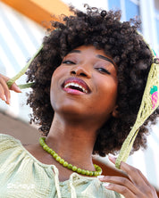 A necklace of glossy quartz beads in fresh lime and green grape tones for a zesty pop of color