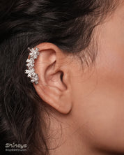 Ear cuffs with shimmering zircon blossoms, designed to hug the curve of the ear for a sparkling look